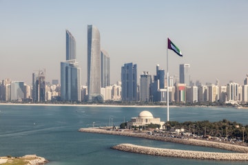 Elevated view of Abu Dhabi downtown skyline and corniche with the flag pole. United Arab Emirates, Middle East