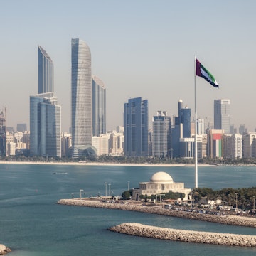 Elevated view of Abu Dhabi downtown skyline and corniche with the flag pole. United Arab Emirates, Middle East
