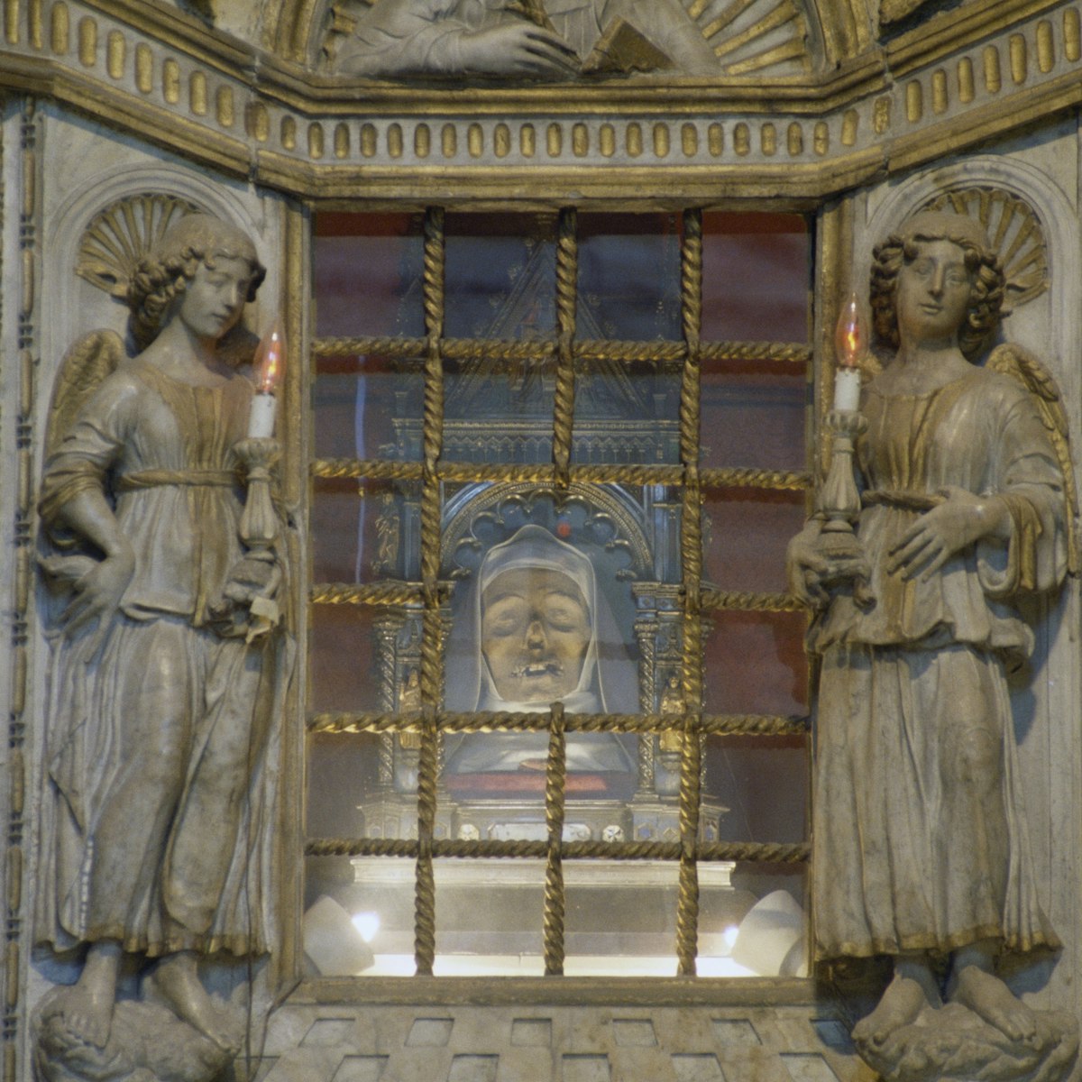 St Catherine of Siena's incorrupt head, marble altar by Giovanni di Stefano, 1469, interior of Basilica of San Domenico, historic centre of Siena (UNESCO World Heritage List, 1995), Tuscany, Italy