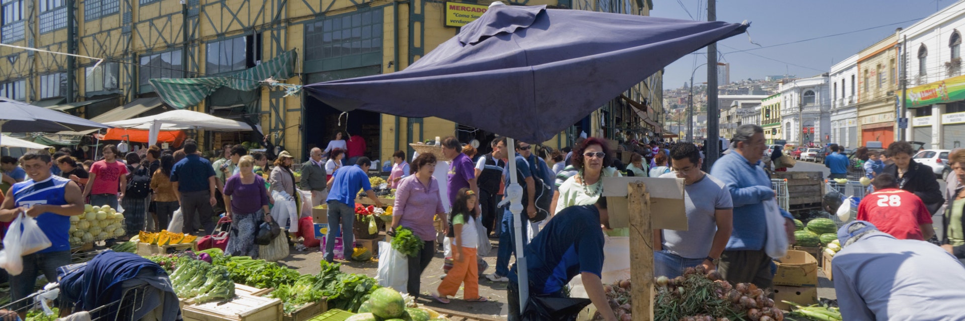 Vendors and buyers at Mercado Cardonal, ValparaIso, Chile