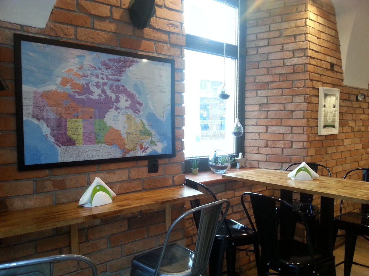 Antler Poutine&Burger, the modest eatery has a Canadian theme with maps and antler decor