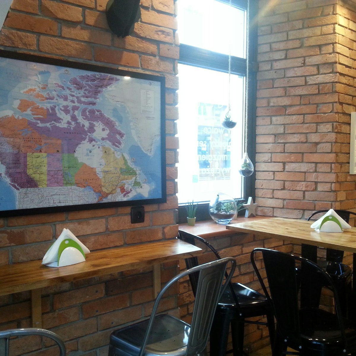 Antler Poutine&Burger, the modest eatery has a Canadian theme with maps and antler decor