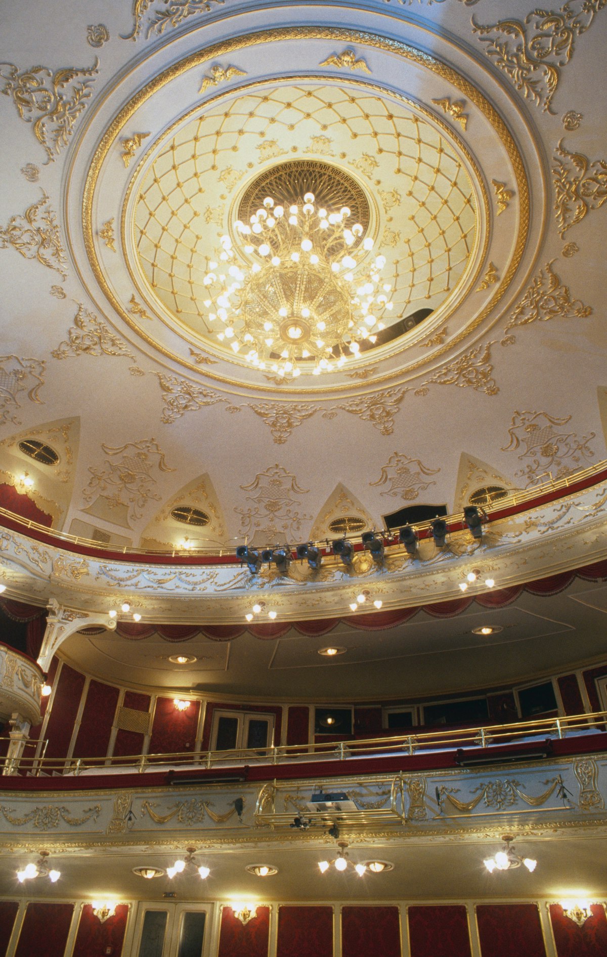 Decorated ceiling and galleries at neo-Classical Comedy Theatre.