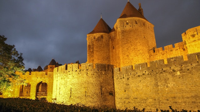 Remparts at dusk, Carcassonne, Languedoc-Roussillon, France on October 9, 2014; Shutterstock ID 578464048; Your name (First / Last): Daniel Fahey; GL account no.: 65050; Netsuite department name: Online Editorial; Full Product or Project name including edition: La Cité POI