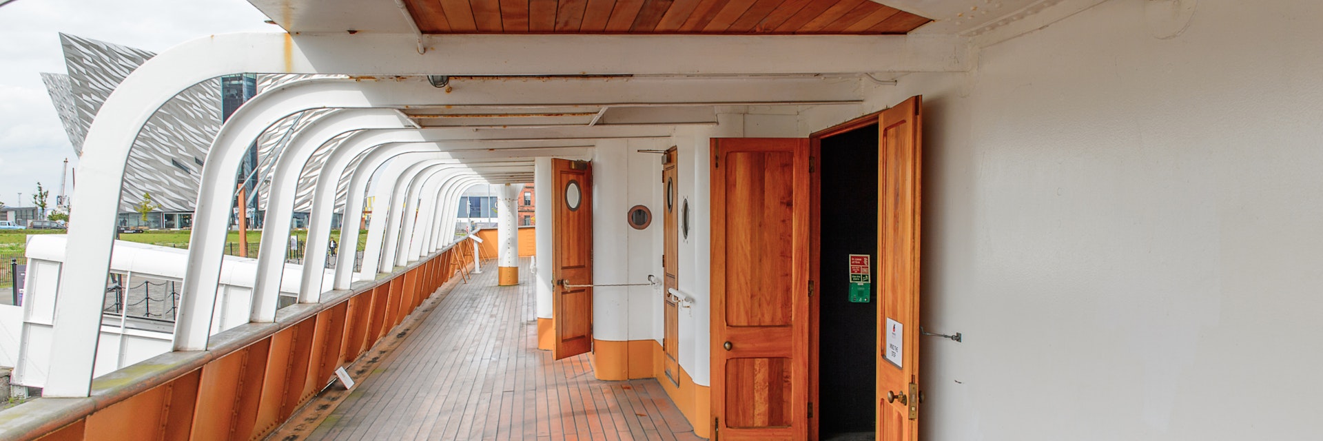 BELFAST, NI - JULY 16, 2016: Door at the SS Nomadic (1911), a steamship of the White Star Line. It was a tender to RMS Titanic on 10.04.1912; Shutterstock ID 452505922; Your name (First / Last): Lauren Gillmore; GL account no.: 56530; Netsuite department name: Online-Design; Full Product or Project name including edition: 65050/ Online Design /LaurenGillmore/POI
