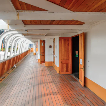 BELFAST, NI - JULY 16, 2016: Door at the SS Nomadic (1911), a steamship of the White Star Line. It was a tender to RMS Titanic on 10.04.1912; Shutterstock ID 452505922; Your name (First / Last): Lauren Gillmore; GL account no.: 56530; Netsuite department name: Online-Design; Full Product or Project name including edition: 65050/ Online Design /LaurenGillmore/POI