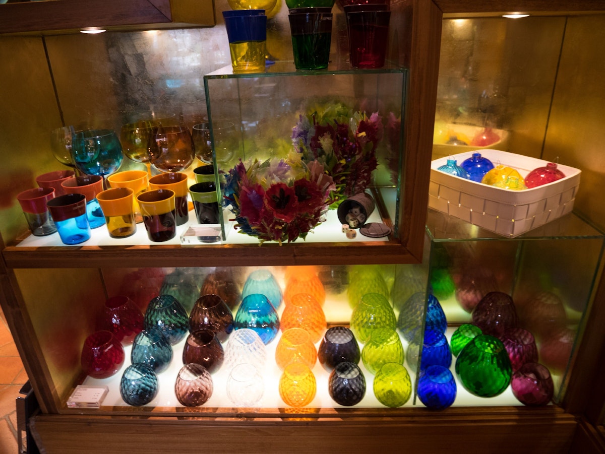 Giobagnara, colourful Nason e Moretti glasswear pieces line the shelves
