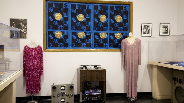 Display of blues artifacts and memorabilia including dresses and sound equipment at Willie Dixon's Blues Heaven, South Loop.