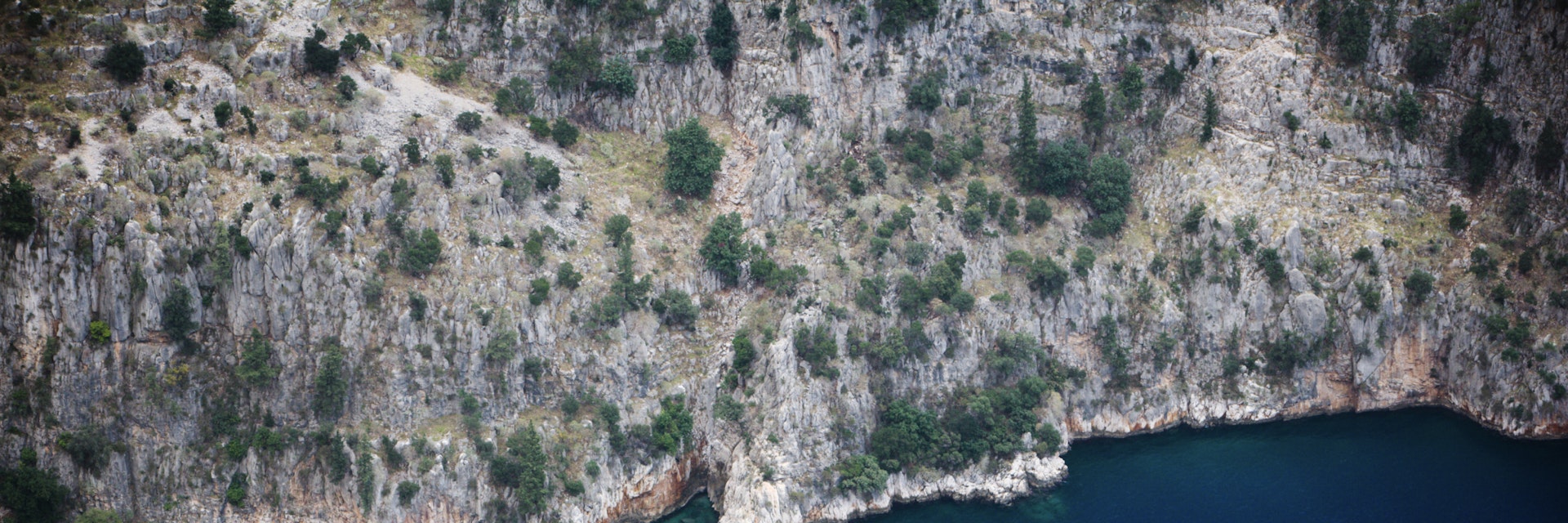 Aerial of yacht and cliff face at Butterfly Valley.
