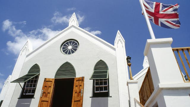 bermuda, st george s island, st. georges, st peters church facade with open door and windows, british union jack flag flying outside.