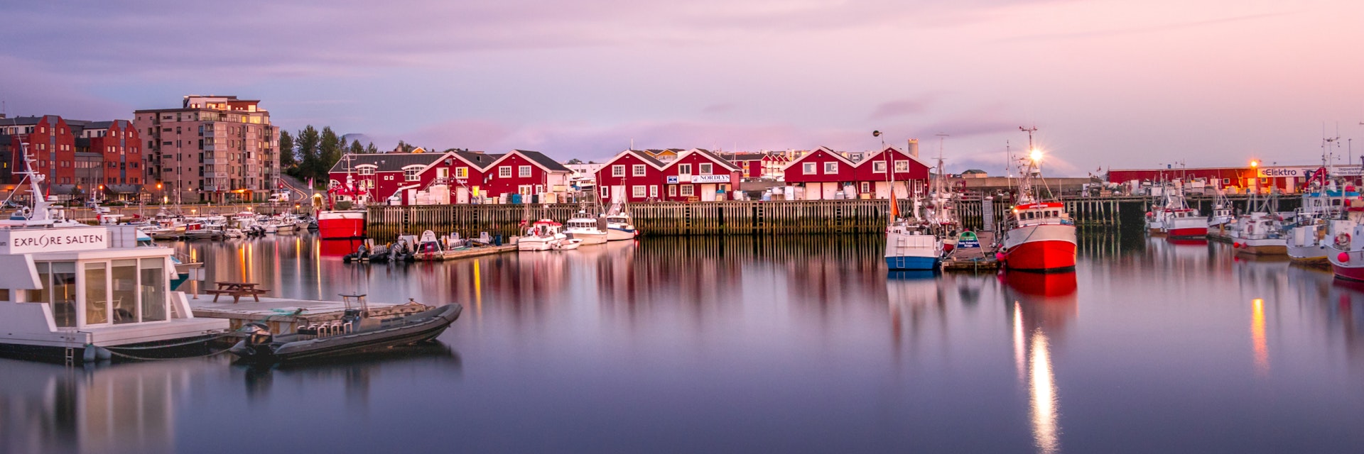 Bodo, Norway - August 2th, 2018: View of the Port of Bodo at evening in summer, Norway.; Shutterstock ID 1257926134; Your name (First / Last): Gemma Graham; GL account no.: 65050; Netsuite department name: Online Editiorial; Full Product or Project name including edition: Masthead image for Bodo, Norway