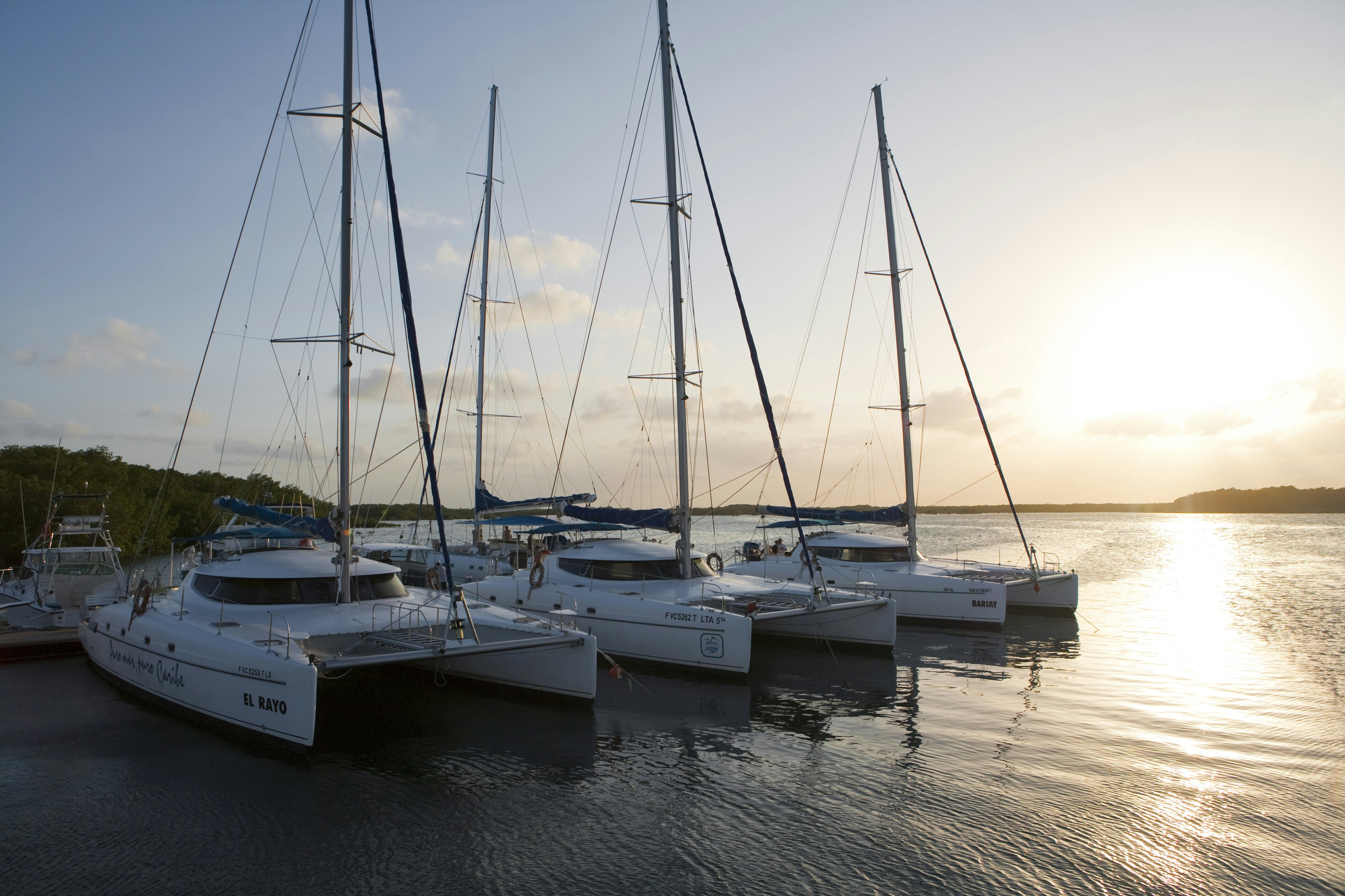 Catamarans at Marina Gaviota at sunset.