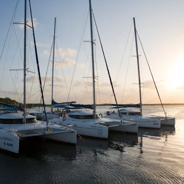 Catamarans at Marina Gaviota at sunset.