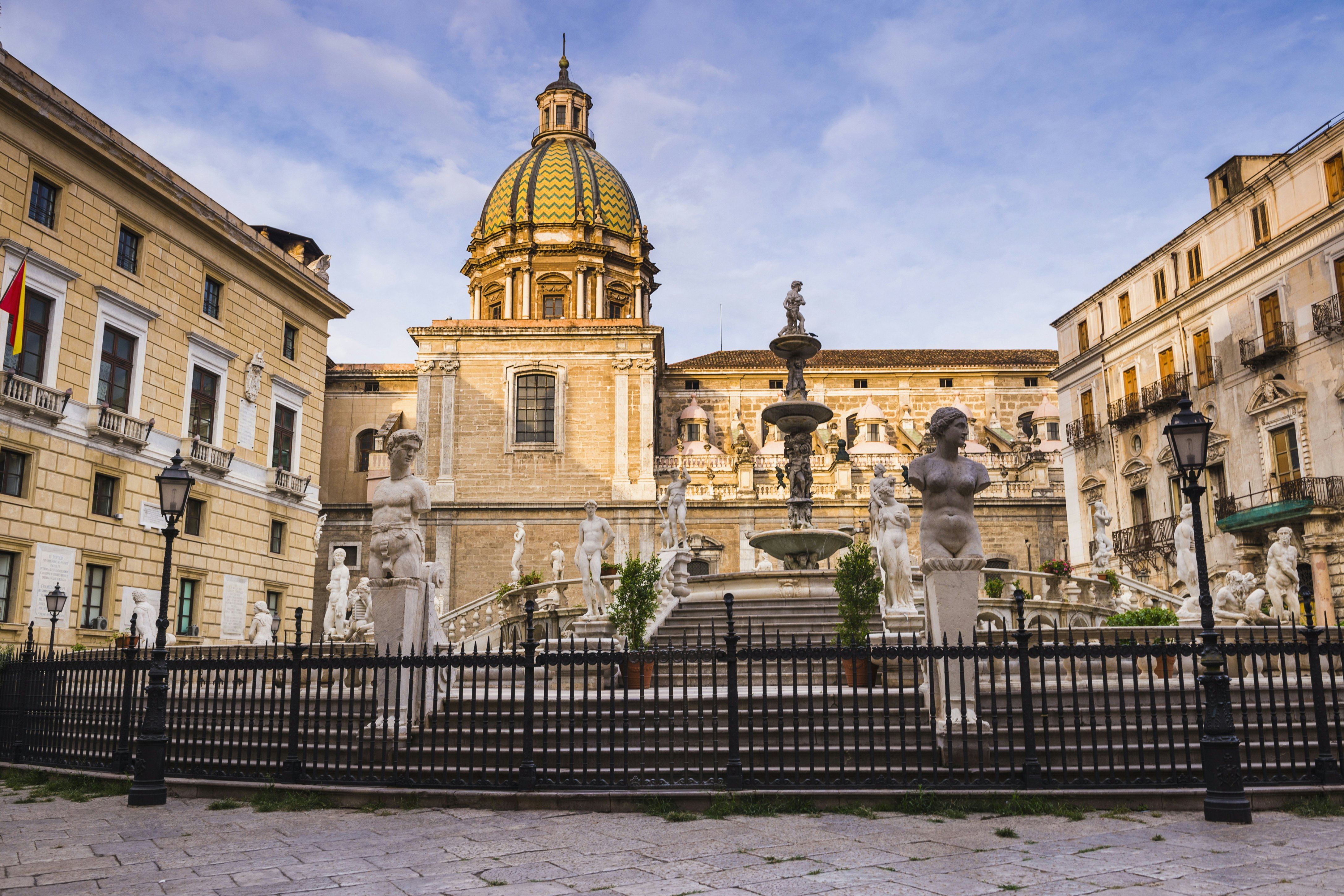 Pretoria Fountain in Piazza Pretoria with the dome of Church of San Giuseppe dei Teatini, Palermo, Sicily, Italy, Europe