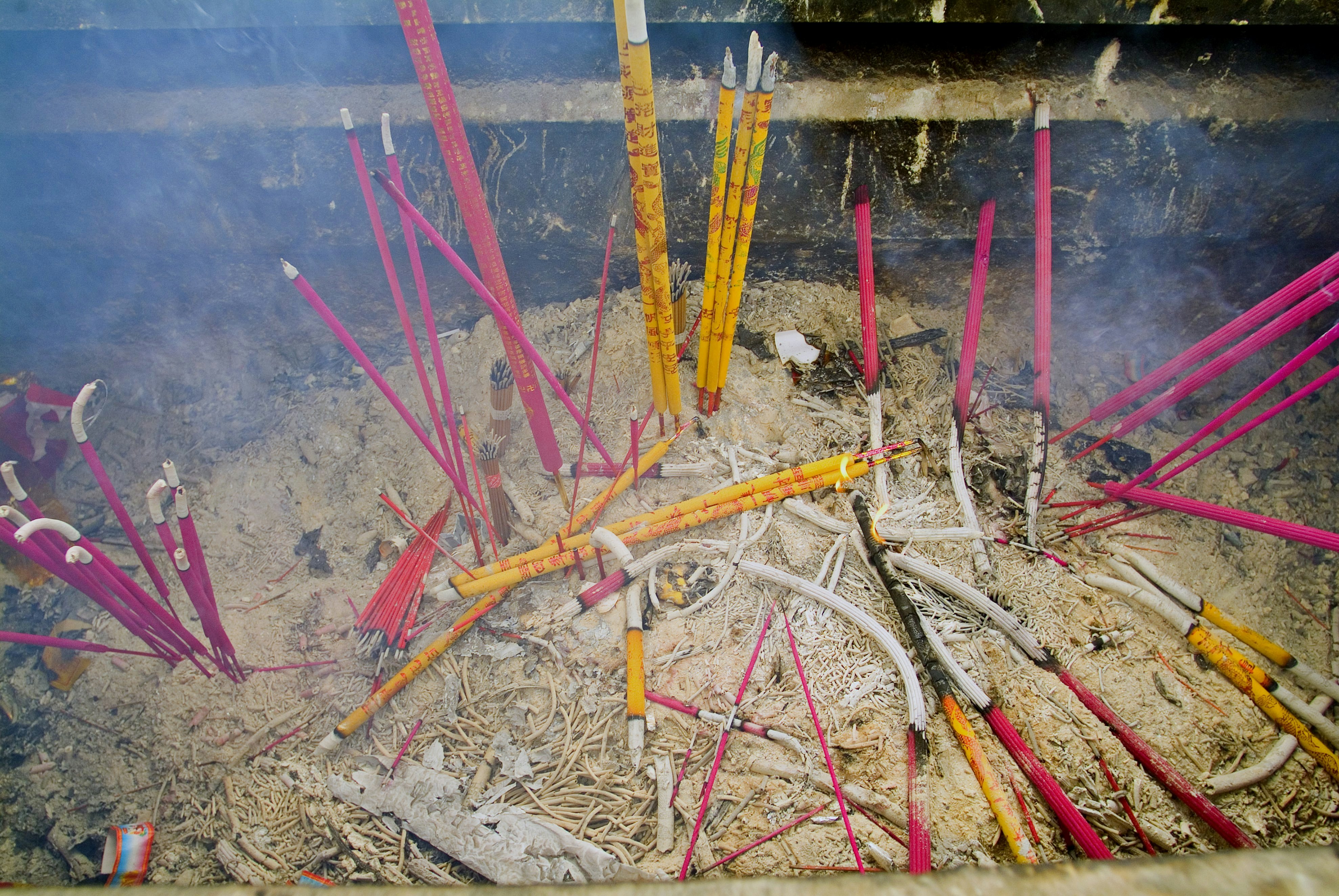 Burning incense at White Cloud Temple, Taoist College.