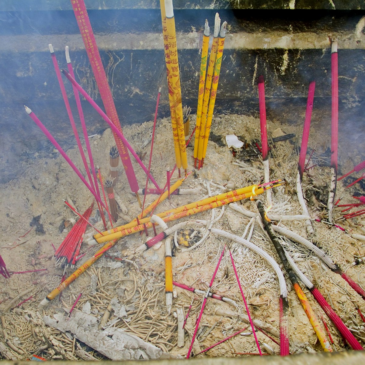 Burning incense at White Cloud Temple, Taoist College.
