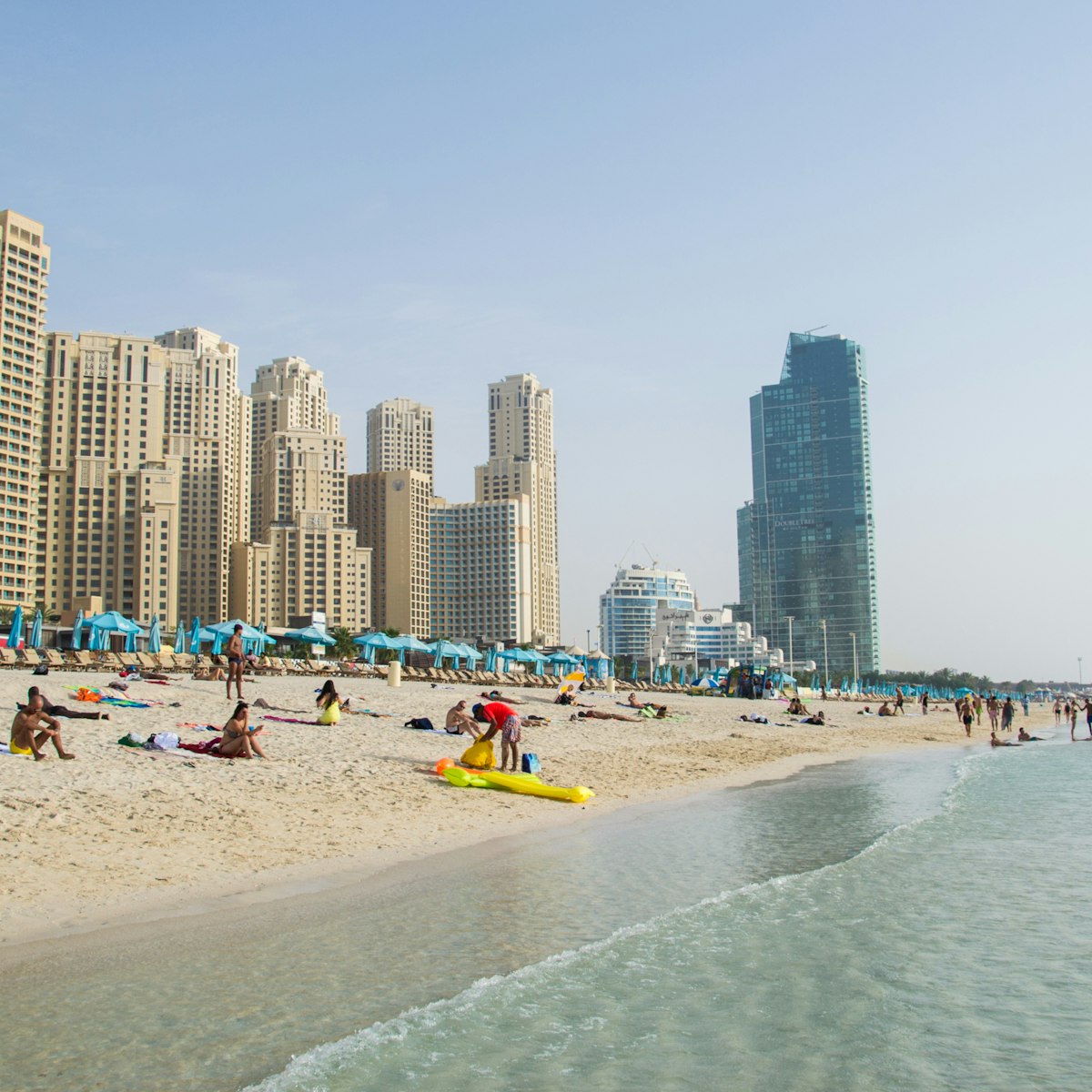 Dubai, UAE - 18 Juny 2016: Dubai Marina JBR beach; Shutterstock ID 561378172; Your name (First / Last): Lauren Keith; GL account no.: 65050; Netsuite department name: Online Editorial; Full Product or Project name including edition: Authentic Dubai Article
