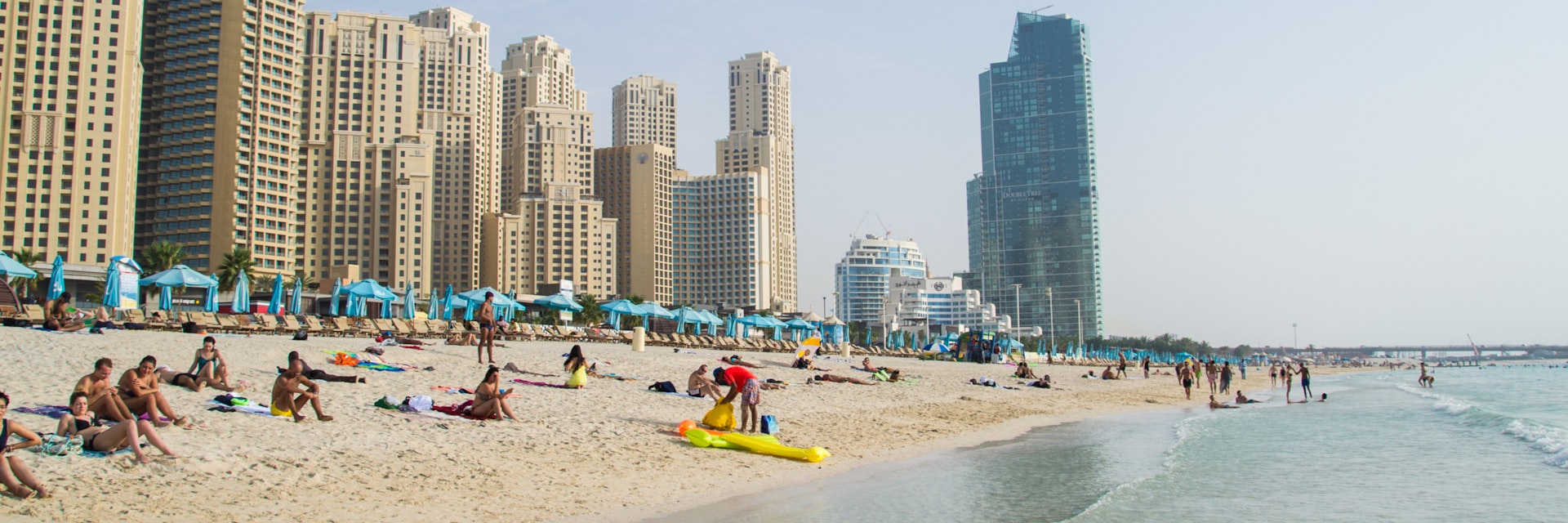 Dubai, UAE - 18 Juny 2016: Dubai Marina JBR beach; Shutterstock ID 561378172; Your name (First / Last): Lauren Keith; GL account no.: 65050; Netsuite department name: Online Editorial; Full Product or Project name including edition: Authentic Dubai Article