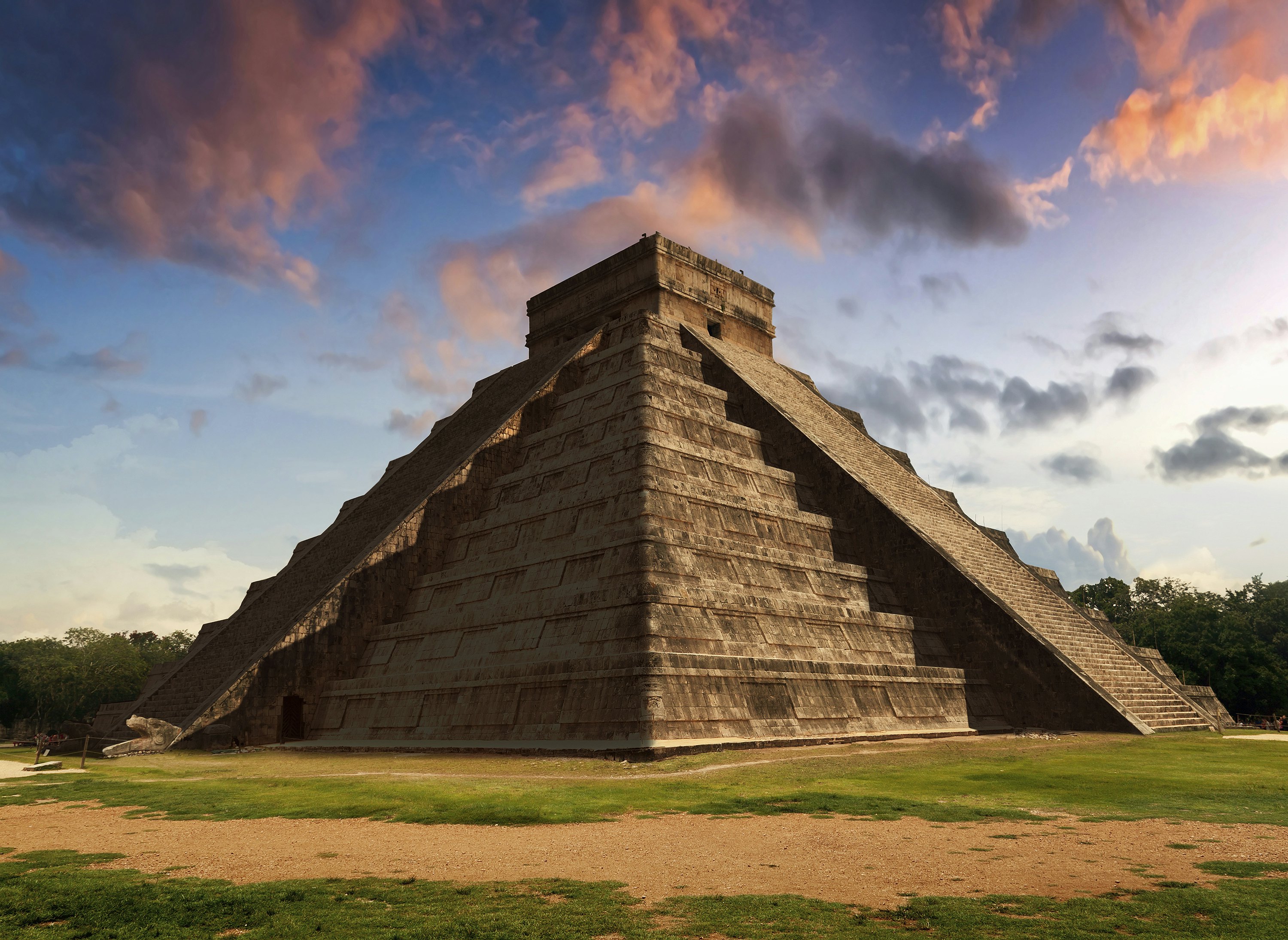 Representation of The Feather Serpent during spring equinox in Kukulkan Pyramid, Chichen Itza. This spectacular phenomenon occurs only twice a year: on 21 March and 22 September. During these two days the temple of Kukulkan at Chichen Itza lives a mysterious marvel related to the Maya religious tradition and worship the God Quetzalcoatl. A phenomenon that concentrates thousands of visitors who travel every year to watch the descent of "The Feathered Serpent".