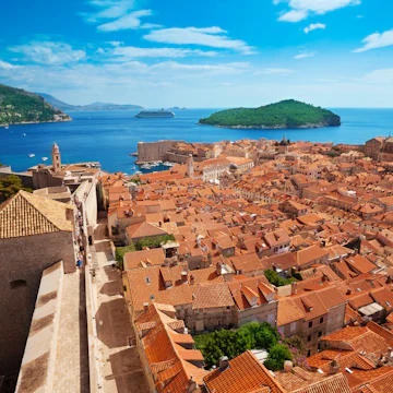 Old town of Dubrovnik with Lokrum island on background with red roofs; Shutterstock ID 151850840; Your name (First / Last): Josh Vogel; Project no. or GL code: 56530; Network activity no. or Cost Centre: Online-Design; Product or Project: 65050/7529/Josh Vogel/LP.com Destination Galleries