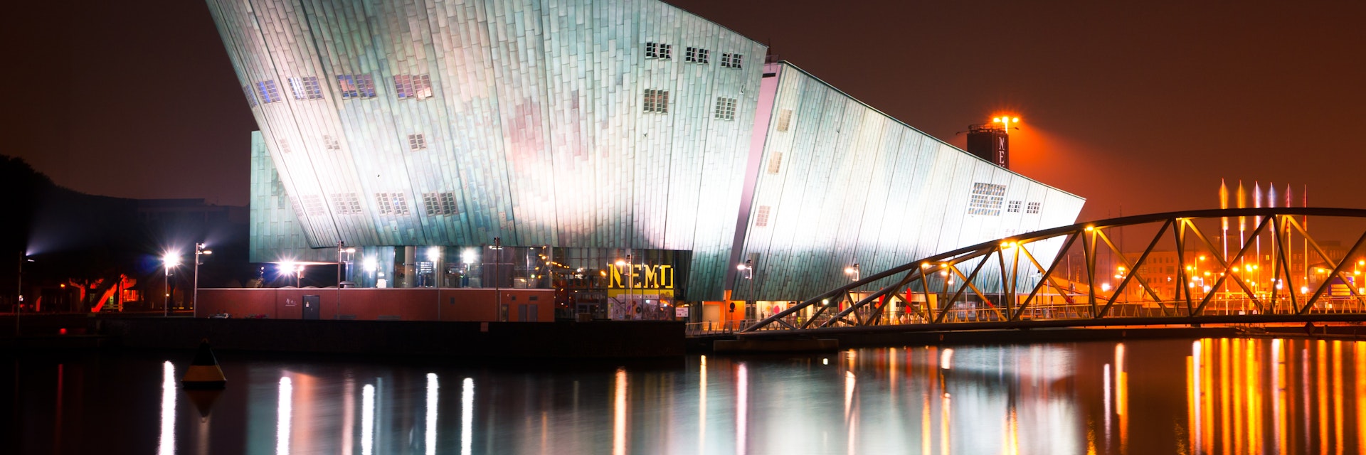 AMSTERDAM, NETHERLANDS - JULY 27: The Nemo Museum at night on July 27, 2013 in Amsterdam, Netherlands. Science Center NEMO is designed by Renzo Piano since 1997.; Shutterstock ID 162619127; Your name (First / Last): Josh Vogel; Project no. or GL code: 56530; Network activity no. or Cost Centre: Online-Design; Product or Project: 65050/7529/Josh Vogel/LP.com Destination Galleries