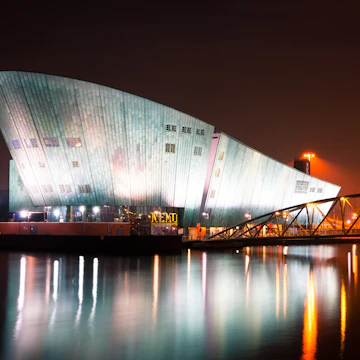 AMSTERDAM, NETHERLANDS - JULY 27: The Nemo Museum at night on July 27, 2013 in Amsterdam, Netherlands. Science Center NEMO is designed by Renzo Piano since 1997.; Shutterstock ID 162619127; Your name (First / Last): Josh Vogel; Project no. or GL code: 56530; Network activity no. or Cost Centre: Online-Design; Product or Project: 65050/7529/Josh Vogel/LP.com Destination Galleries