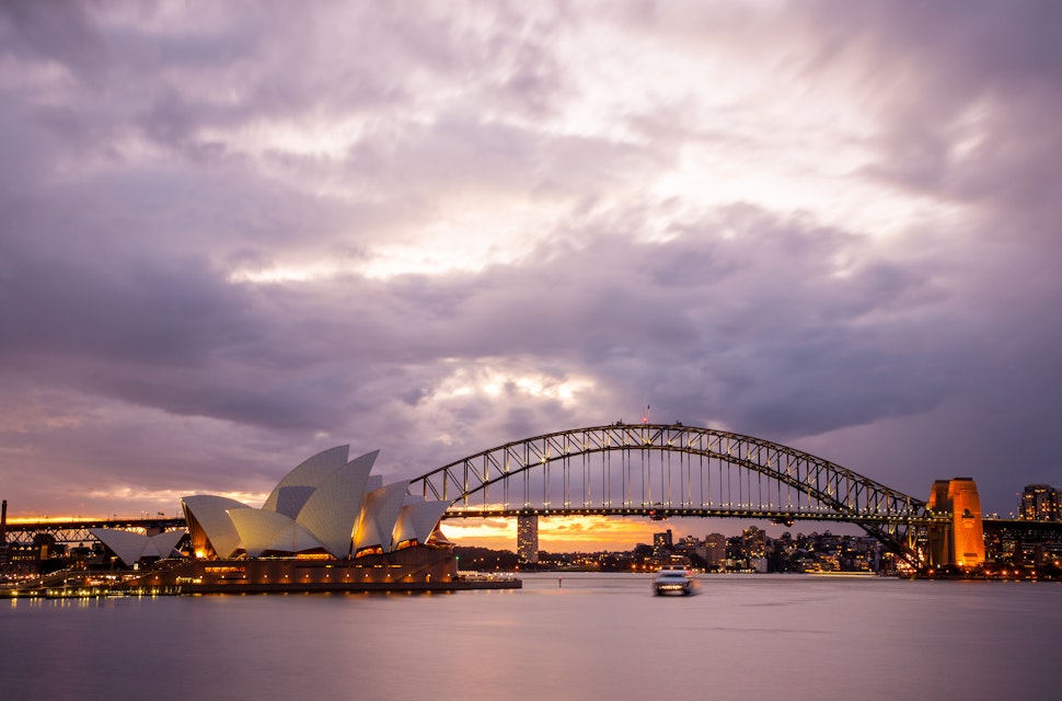 Sydney, Australia - July 11, 2010 : Dramatic sky and the Sydney Opera House at dusk. Sydney skyline taken from Mrs. Macquarie's Point.; Shutterstock ID 185348105; Your name (First / Last): Josh Vogel; Project no. or GL code: 56530; Network activity no. or Cost Centre: Online-Design; Product or Project: 65050/7529/Josh Vogel/LP.com Destination Galleries