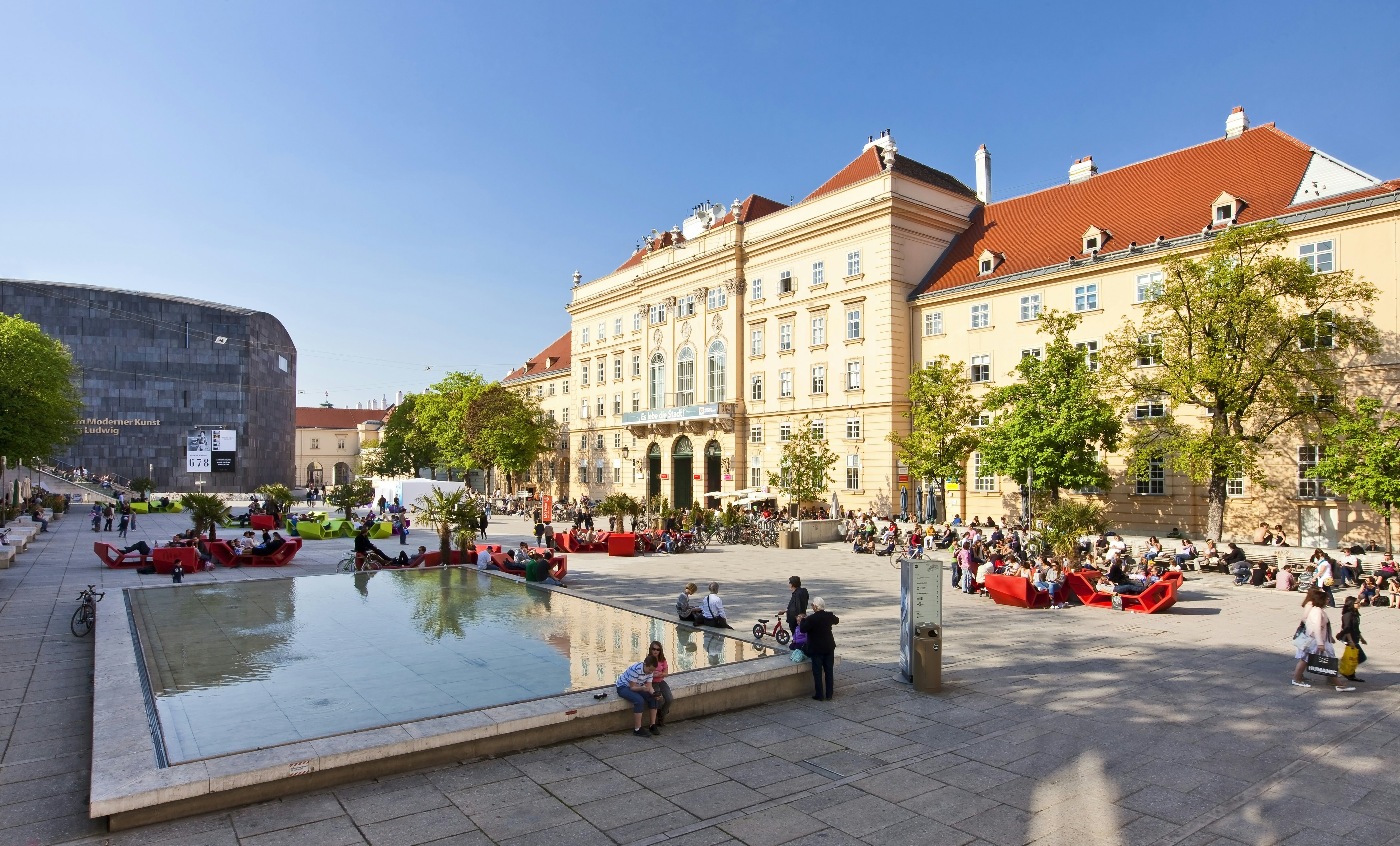 VIENNA, AUSTRIA - APRIL 19: Many people enjoy a sunny afternoon at the Museumsquartier on April 19, 2011 in Vienna. It is the eighth largest cultural area in the world and a very important for Vienna; Shutterstock ID 202273378; Your name (First / Last): Josh Vogel; Project no. or GL code: 56530; Network activity no. or Cost Centre: Online-Design; Product or Project: 65050/7529/Josh Vogel/LP.com Destination Galleries