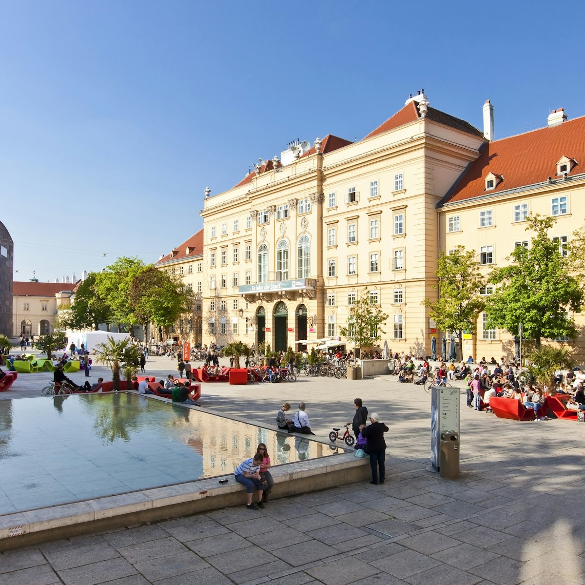 VIENNA, AUSTRIA - APRIL 19: Many people enjoy a sunny afternoon at the Museumsquartier on April 19, 2011 in Vienna. It is the eighth largest cultural area in the world and a very important for Vienna; Shutterstock ID 202273378; Your name (First / Last): Josh Vogel; Project no. or GL code: 56530; Network activity no. or Cost Centre: Online-Design; Product or Project: 65050/7529/Josh Vogel/LP.com Destination Galleries
