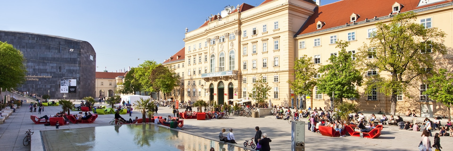 VIENNA, AUSTRIA - APRIL 19: Many people enjoy a sunny afternoon at the Museumsquartier on April 19, 2011 in Vienna. It is the eighth largest cultural area in the world and a very important for Vienna; Shutterstock ID 202273378; Your name (First / Last): Josh Vogel; Project no. or GL code: 56530; Network activity no. or Cost Centre: Online-Design; Product or Project: 65050/7529/Josh Vogel/LP.com Destination Galleries