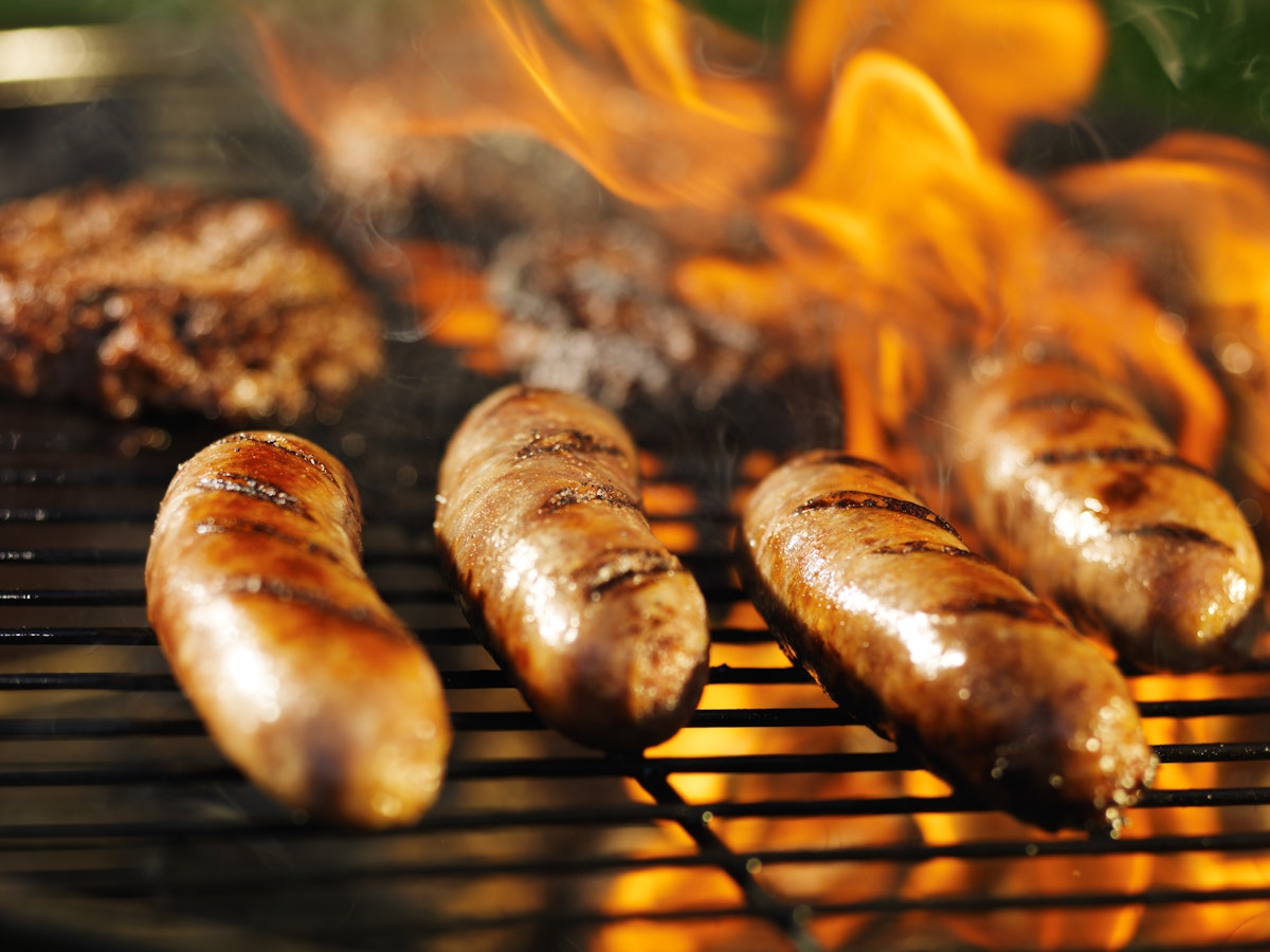 bratwursts cooking on flaming grill; Shutterstock ID 219229759; Your name (First / Last): Josh Vogel; Project no. or GL code: 56530; Network activity no. or Cost Centre: Online-Design; Product or Project: 65050/7529/Josh Vogel/LP.com Destination Galleries