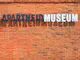 JOHANNESBURG, AUGUST 21: Apartheid Museum sign on August 21, 2014 in Johannesburg. The Apartheid Museum is dedicated to illustrating apartheid and the 20th century history of South Africa; Shutterstock ID 219540106; Your name (First / Last): Josh Vogel; Project no. or GL code: 56530; Network activity no. or Cost Centre: Online-Design; Product or Project: 65050/7529/Josh Vogel/LP.com Destination Galleries