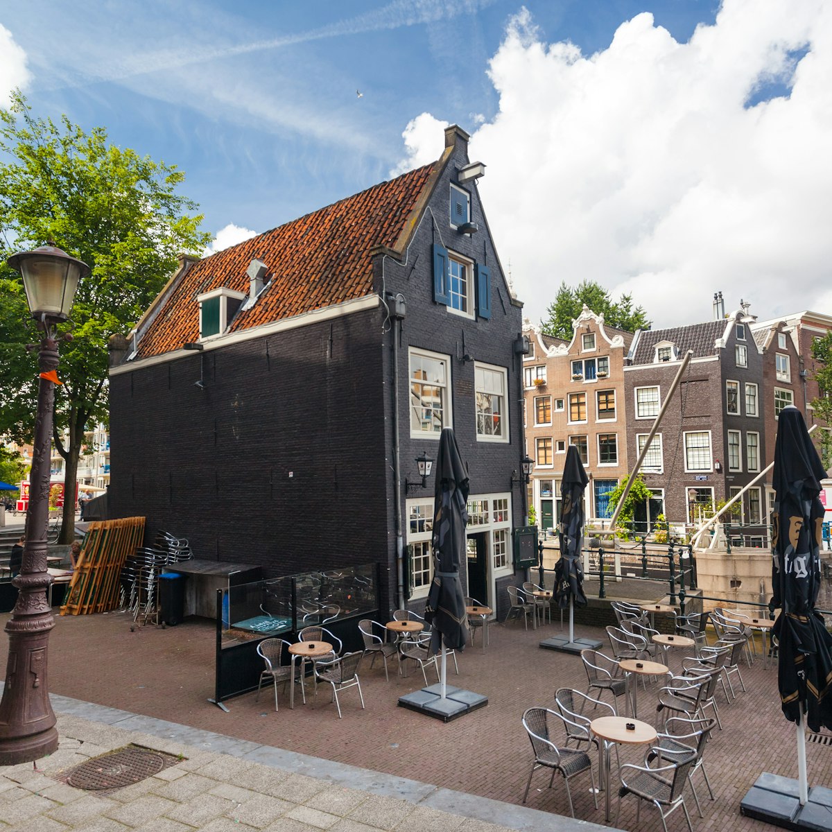 AMSTERDAM - NETHERLANDS: AUGUST 14, 2014: Cafe de Sluyswacht. It is in the historical lockhouse and is dating from 1695 in the Jodenbreestraat.; Shutterstock ID 222122779; Your name (First / Last): Josh Vogel; Project no. or GL code: 56530; Network activity no. or Cost Centre: Online-Design; Product or Project: 65050/7529/Josh Vogel/LP.com Destination Galleries