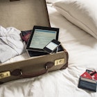Open suitcase, ipad, phone and passport.jpg