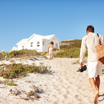 Rear view of father and son heading back to the cottage