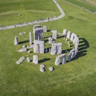AMESBURY, WILTSHIRE, UNITED KINGDOM - OCTOBER 03, 2016: Aerial photograph showing people visiting Stonehenge which is a UNESCO World Heritage Site in England.