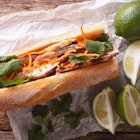 Vietnamese Pork Banh Mi Sandwich with Cilantro and carrot close-up on the table. horizontal view from above