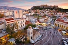 Athens, Greece - December 01, 2016:  View of Acropolis from a roof-top coffee shop in Monastiraki square, Athens.