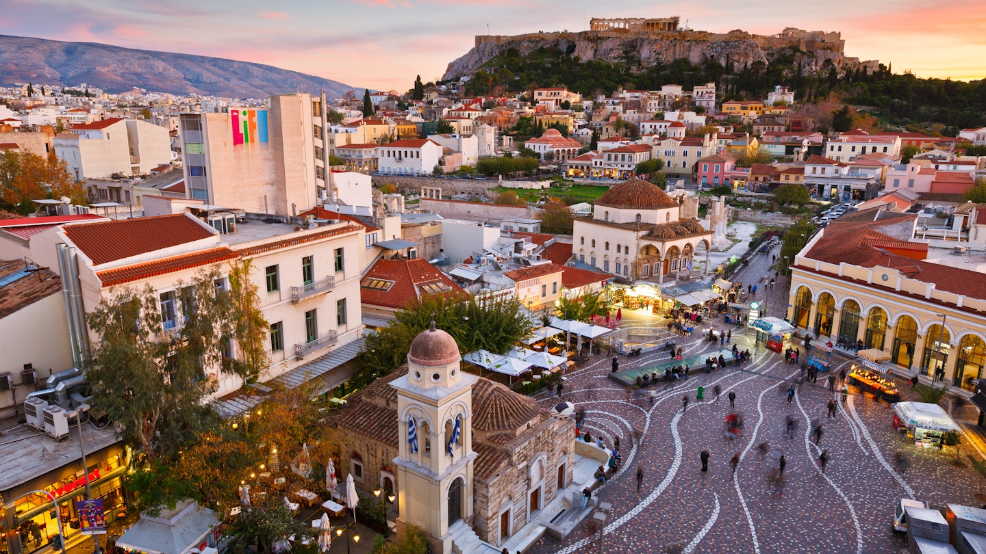 Athens, Greece - December 01, 2016:  View of Acropolis from a roof-top coffee shop in Monastiraki square, Athens.