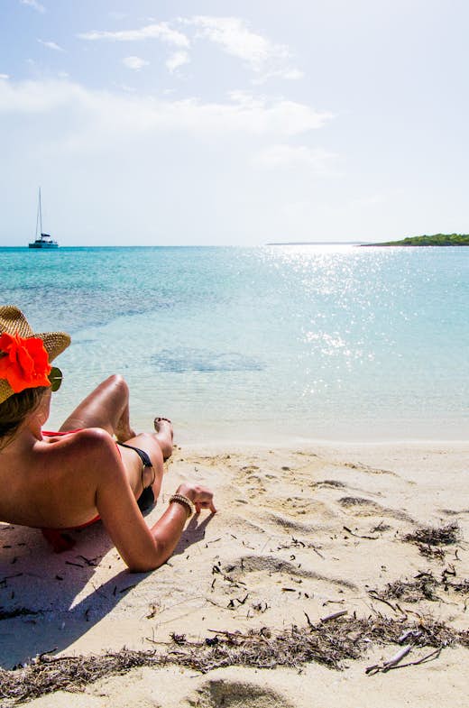 Basking in the sun on a secluded beach in the Exuma's, Bahamas.