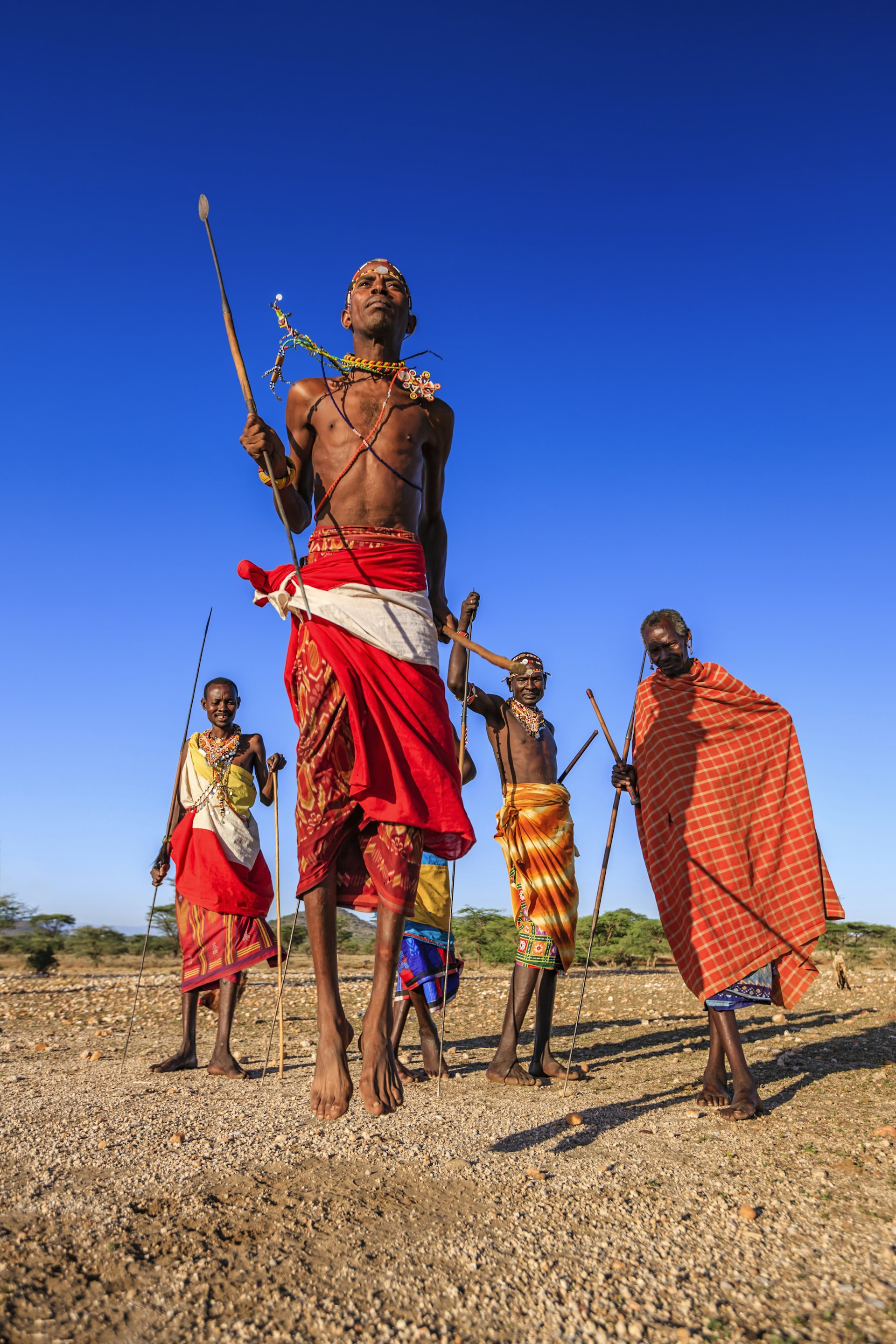 Warrior from Samburu tribe performing traditional jumping dance, Kenya, Africa