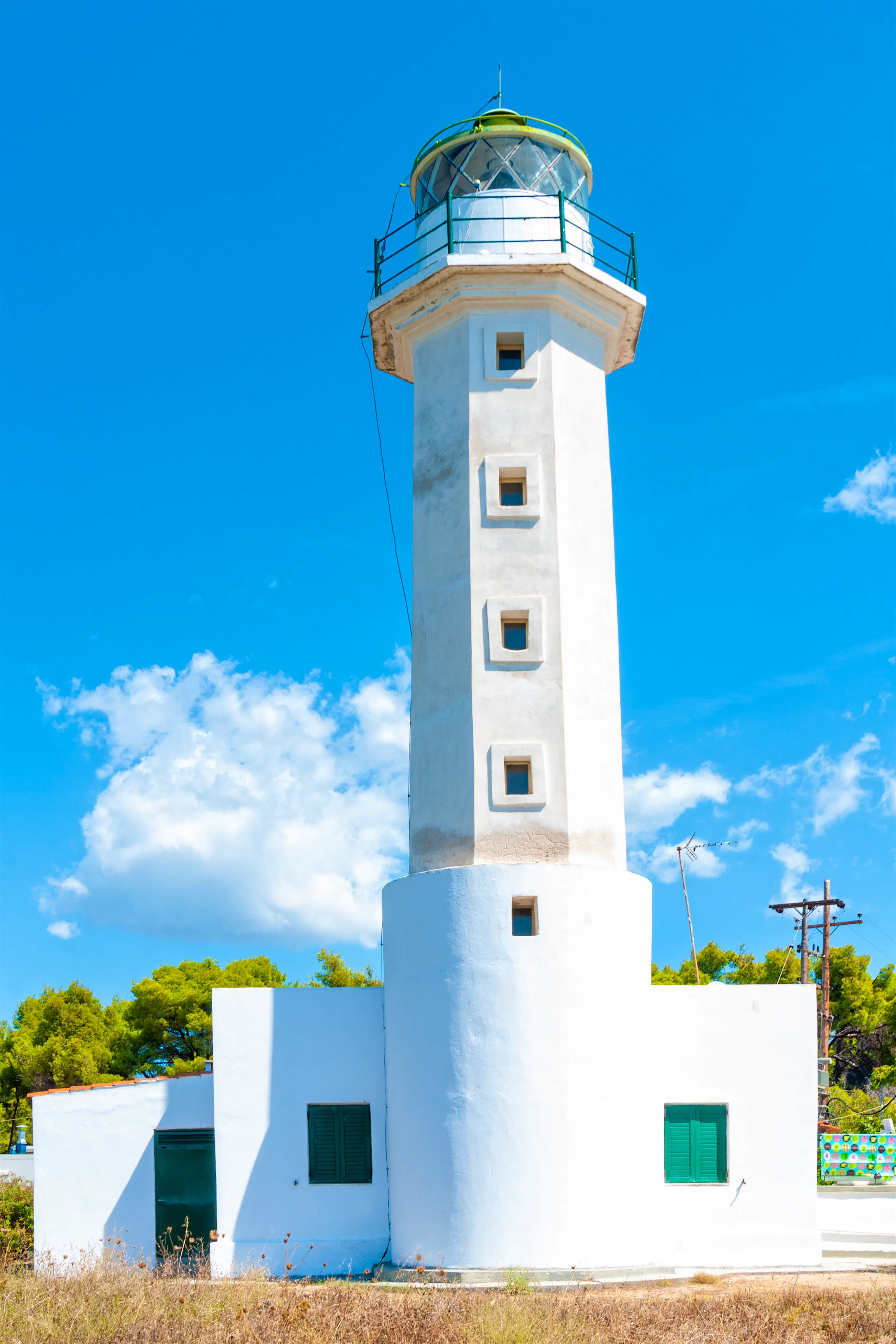 White Possidi lighthouse near Possidi cape in Greece