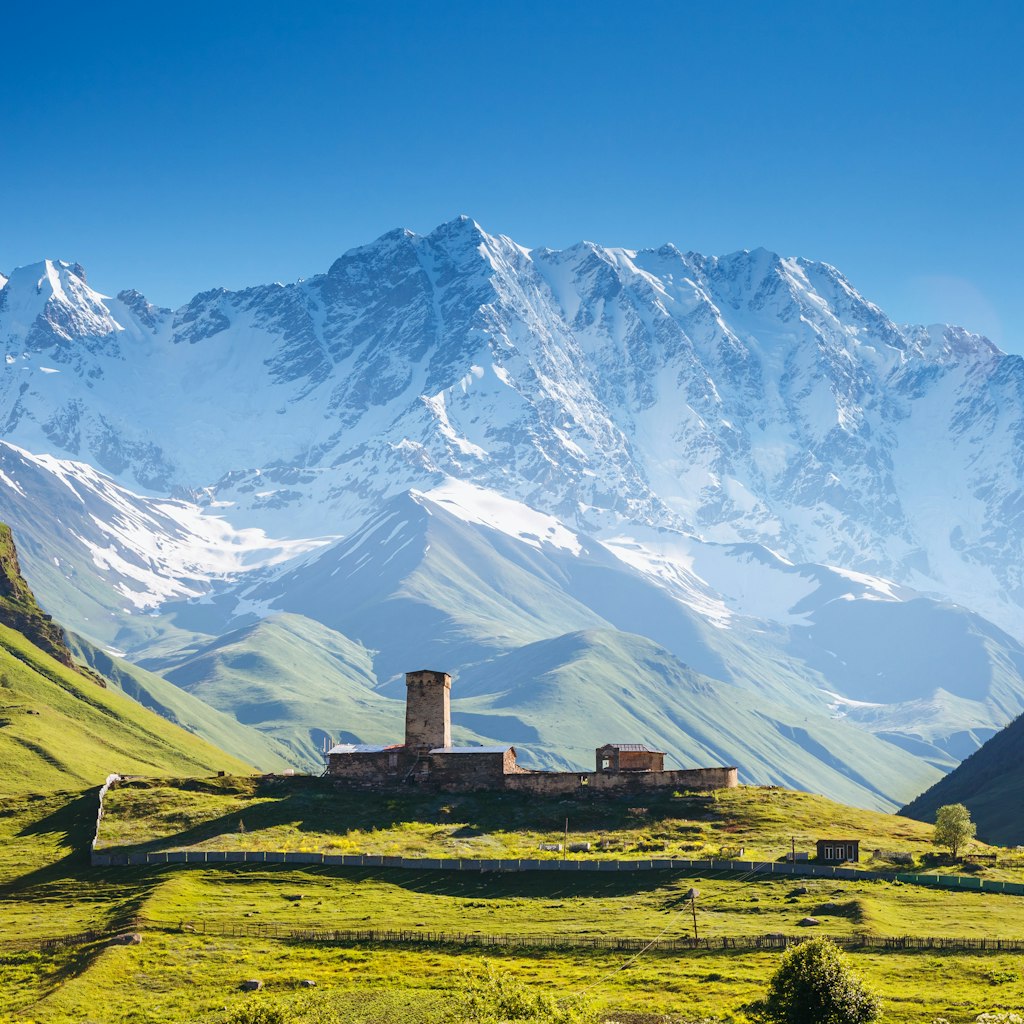 View of the Ushguli village at the foot of Mt. Shkhara. Picturesque and gorgeous scene. Famous tourist attraction. Location place Lamaria Church Jgrag, Upper Svaneti, Georgia, Europe. Beauty world.