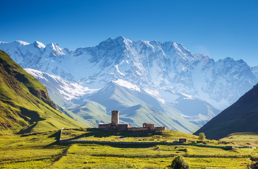 View of the Ushguli village at the foot of Mt. Shkhara. Picturesque and gorgeous scene. Famous tourist attraction. Location place Lamaria Church Jgrag, Upper Svaneti, Georgia, Europe. Beauty world.