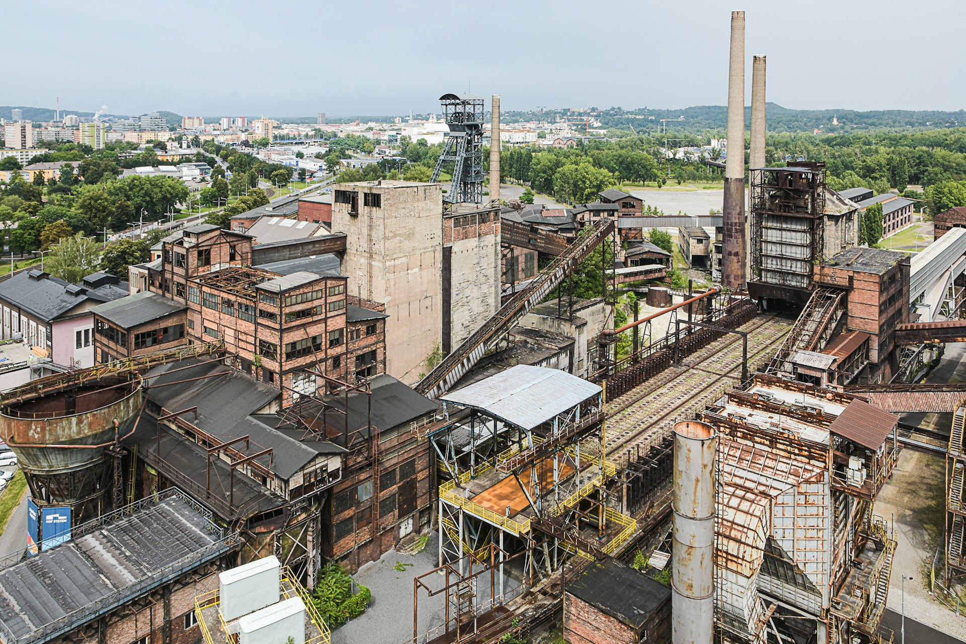 The view over Dolní Vítkovice from the elevated platform of the Bolt Tower, the former blast furnace. The city of Ostrava is visible in the background.