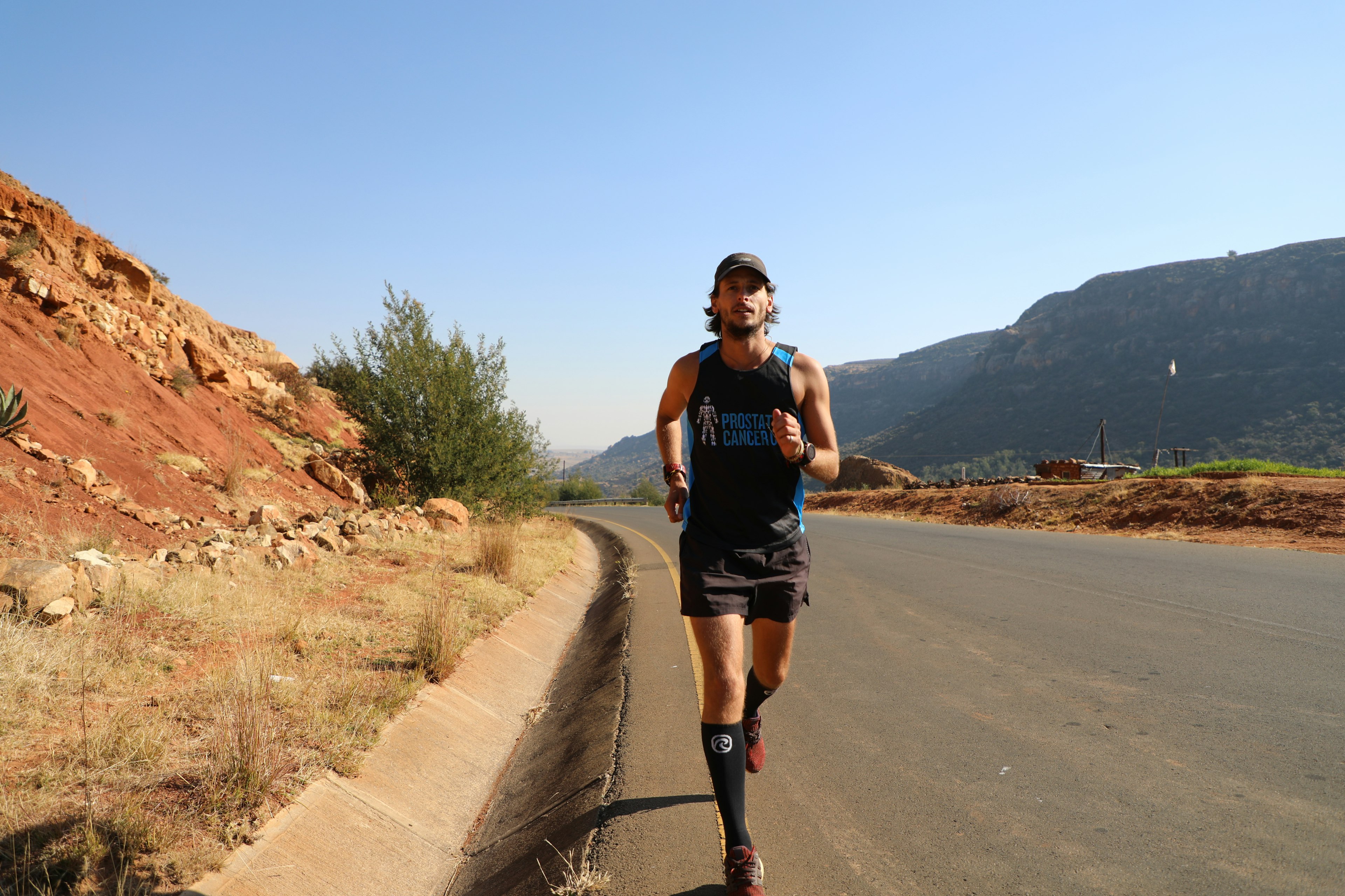 A man running in a desert environment