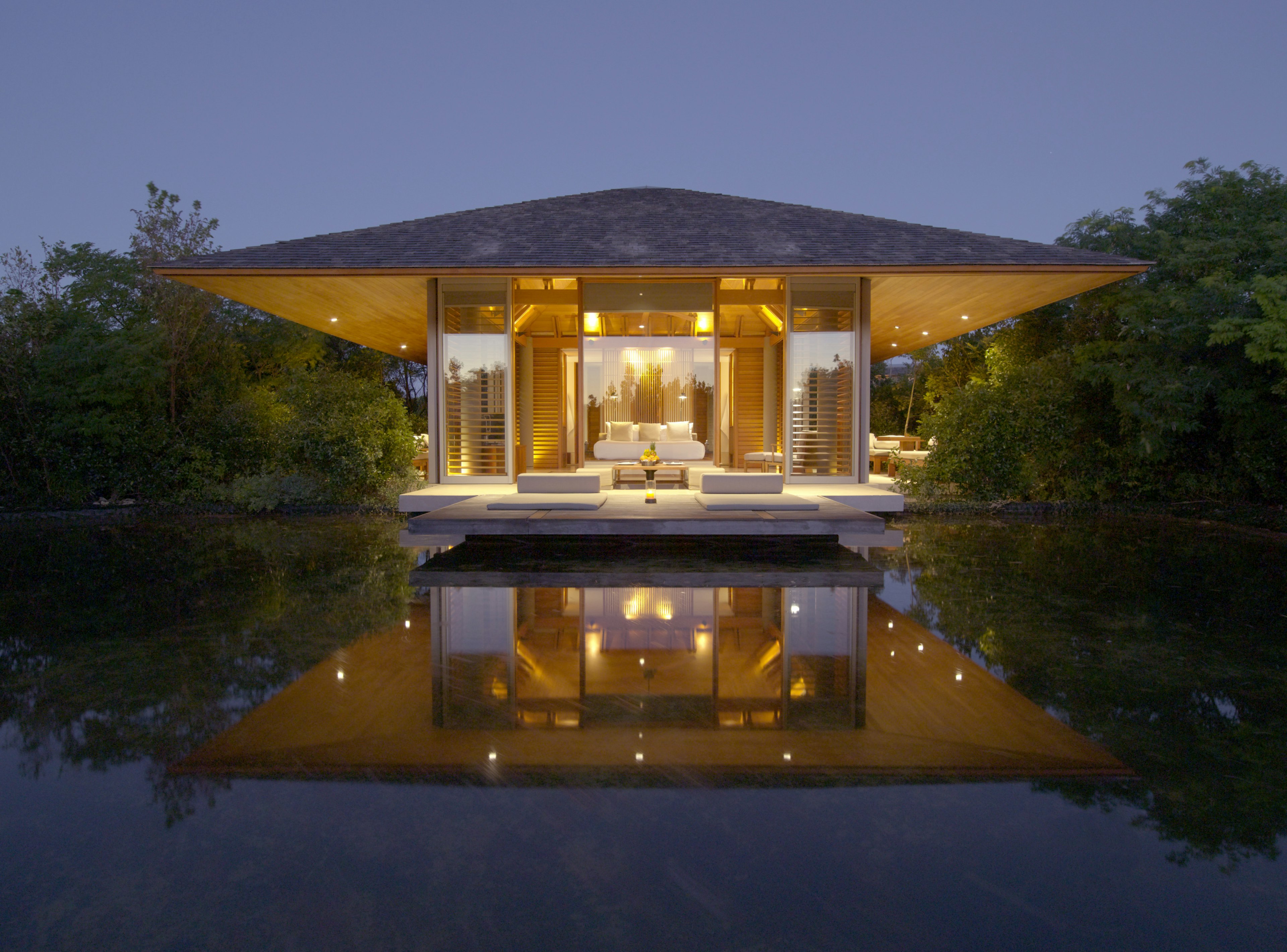 A small villa-style building seems to be surrounded by a pool