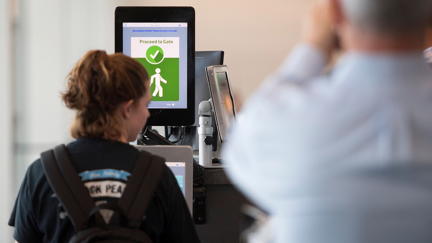 A woman boarding a SAS flight to Copenhagen goes through facial recognition verification system VeriScan at Dulles International Airport in Dulles, Virginia, on September 6, 2018. (Photo by Jim WATSON / AFP)        (Photo credit should read JIM WATSON/AFP via Getty Images)
