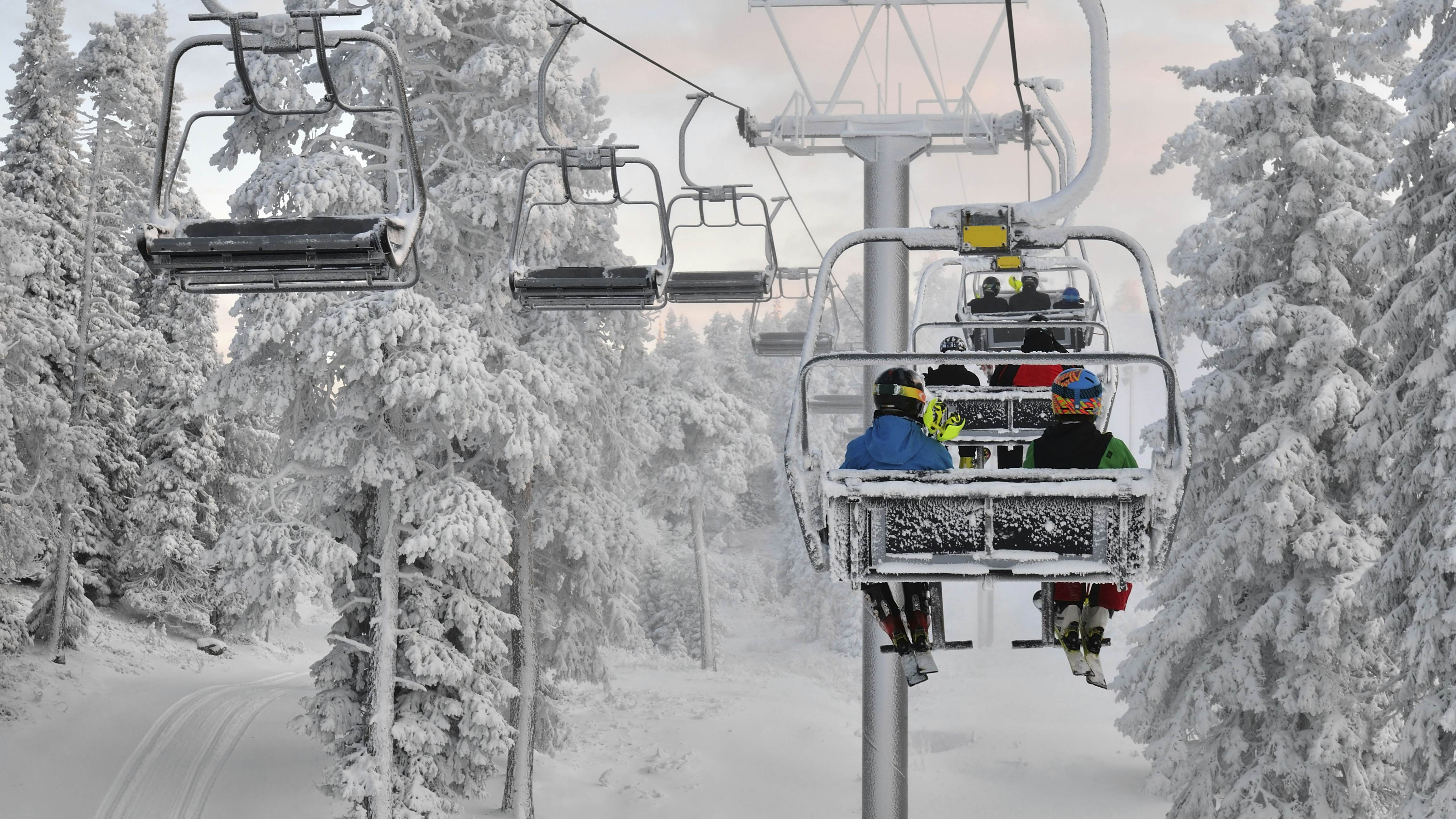 Ski chair lift with skiers