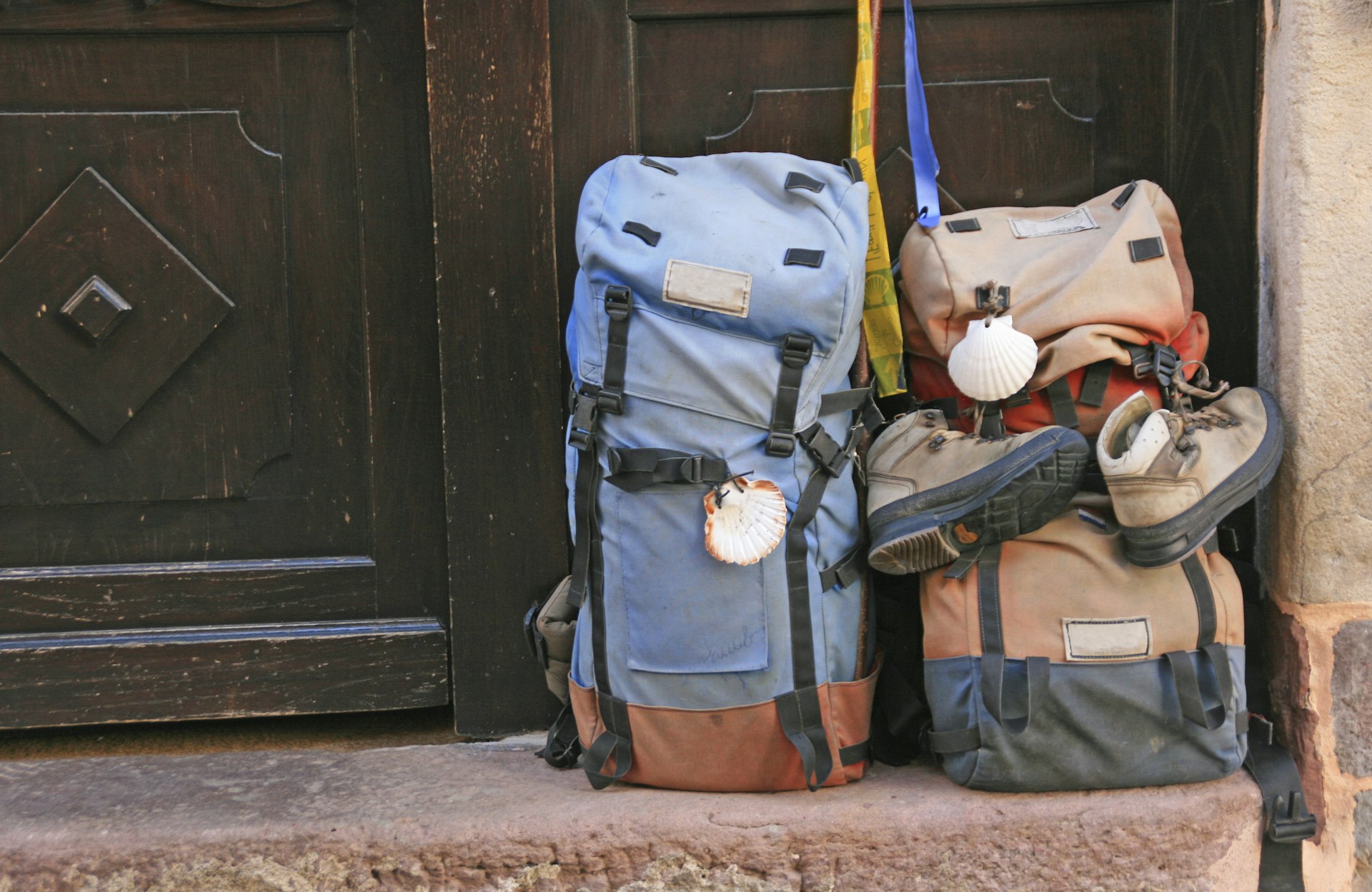 Two backpacks sit in the doorway. 